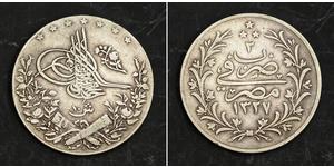  
  1909, Egypt, Sultan Mehmed V. Nice Silver 10 Qirsh Coin. Better Date!  Condition: VF+ Reference: KM-309.   Denomination: 10 Qirsh  Mint Date: 1909 (1327AH+ 2) Mint Place: Heaton´s mint (Birmi ...